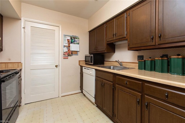 1371 Granada Ct, Newport News, VA 23608 - kitchen with black electric range, stainless steel microwave, dishwasher, wallpapered walls, and light countertops