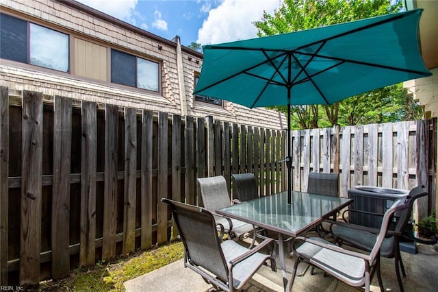 1371 Granada Ct, Newport News, VA 23608 - view of patio with outdoor dining space, fence, and central air condition unit