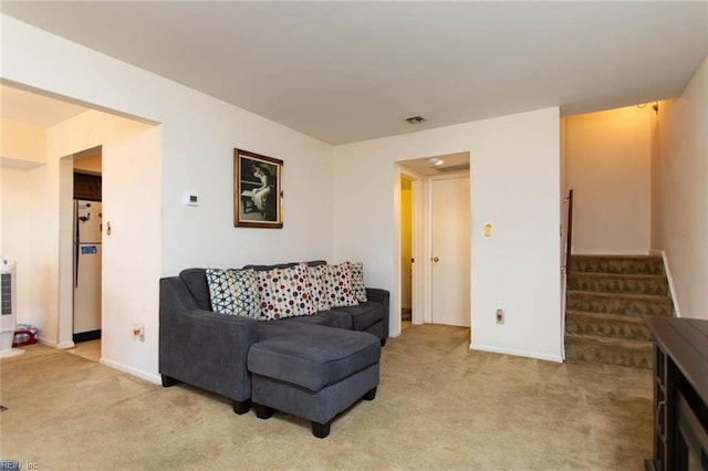 1371 Granada Ct, Newport News, VA 23608 - living area featuring light carpet, stairway, and baseboards