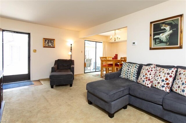 1371 Granada Ct, Newport News, VA 23608 - living room featuring a chandelier, carpet flooring, and baseboards