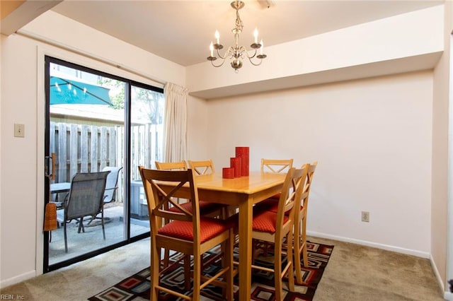 1371 Granada Ct, Newport News, VA 23608 - dining area with carpet floors, a chandelier, and baseboards