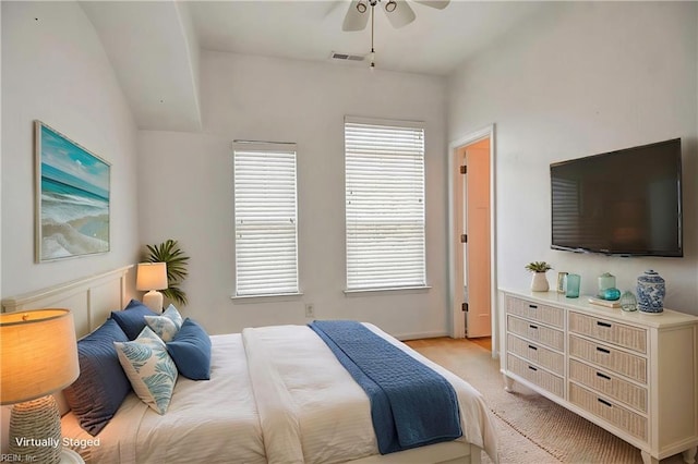 bedroom with light carpet and ceiling fan