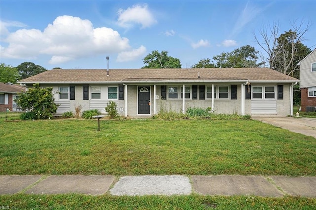 single story home with brick siding, a front yard, and central AC unit