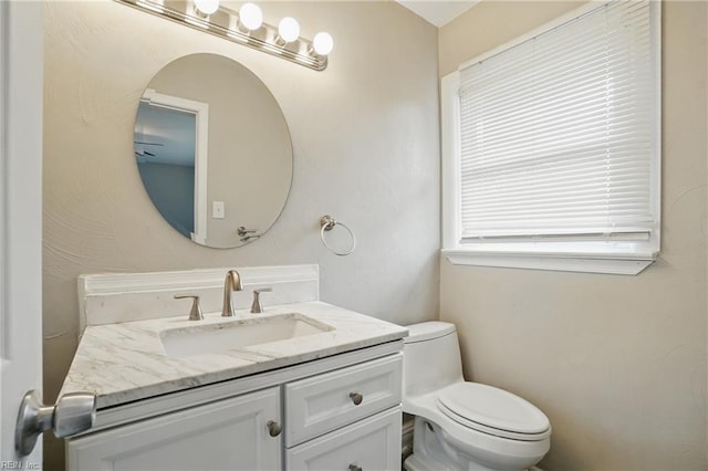 half bath with toilet and vanity