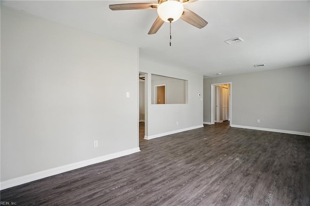 unfurnished room with dark wood-type flooring, baseboards, and ceiling fan