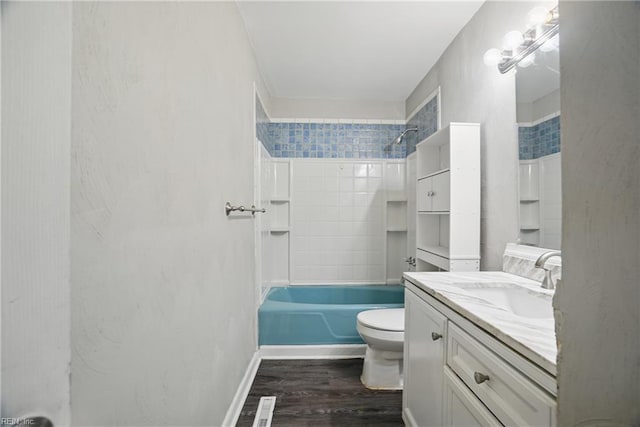 full bathroom with wood finished floors, vanity, toilet, and bathtub / shower combination