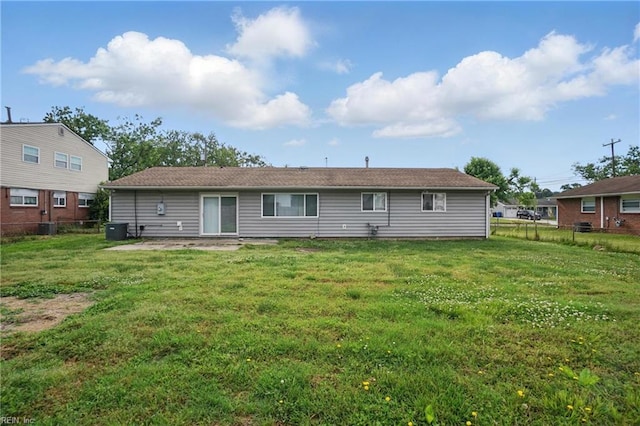 rear view of property featuring central AC
