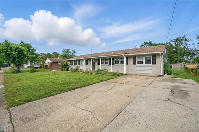 single story home with brick siding and driveway