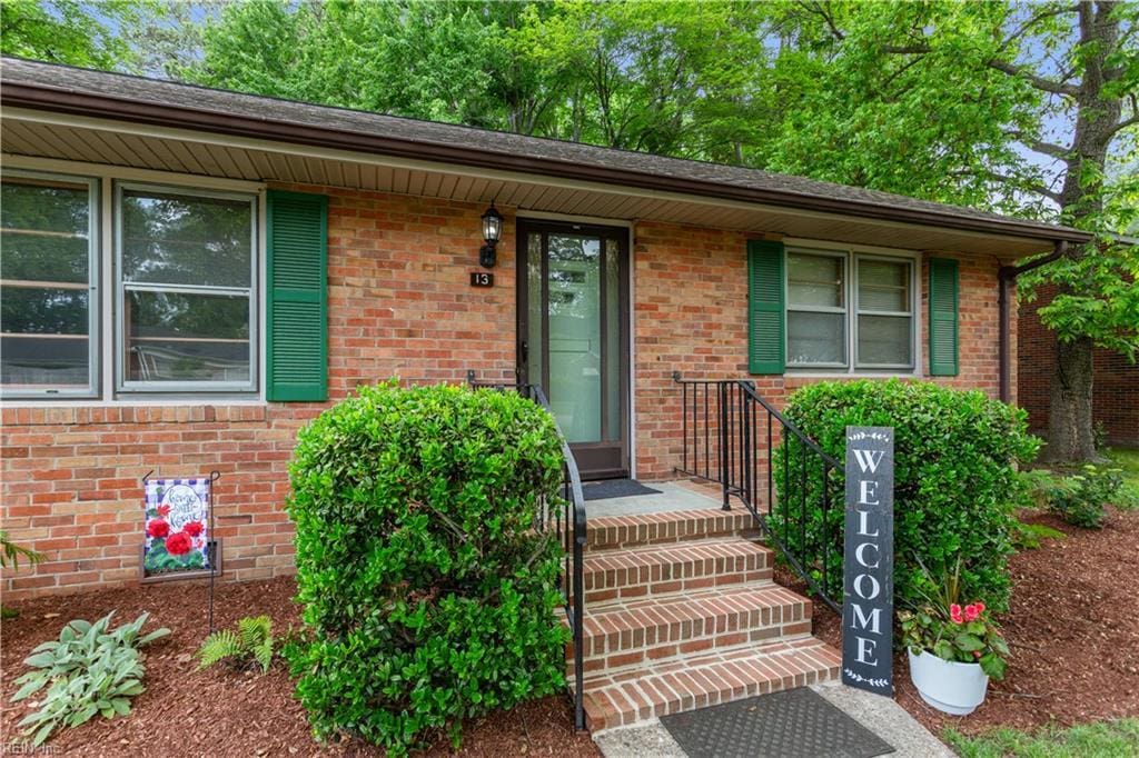 13 Omera Pl, Hampton, VA 23666 - doorway to property with brick siding