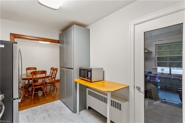 13 Omera Pl, Hampton, VA 23666 - kitchen featuring stainless steel appliances, gray cabinetry, light marble finish floors, and radiator heating unit