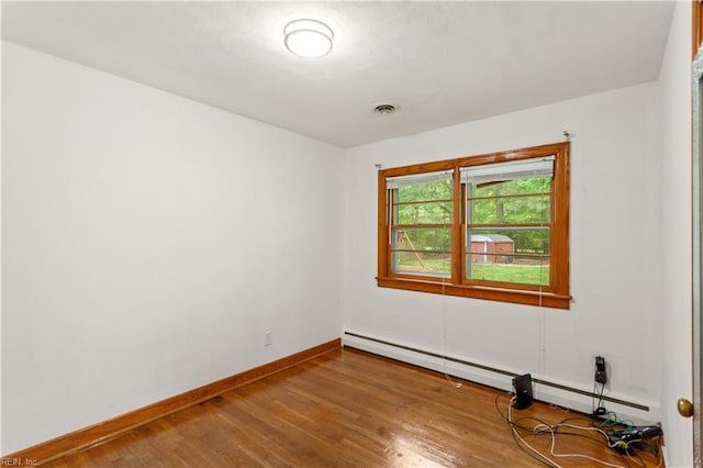13 Omera Pl, Hampton, VA 23666 - empty room featuring a baseboard radiator, baseboards, and wood-type flooring