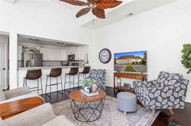 3009 Hogan Way, Suffolk, VA 23435 - living room with a ceiling fan, wood finished floors, and a towering ceiling