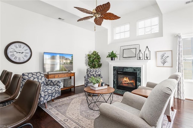 3009 Hogan Way, Suffolk, VA 23435 - living room featuring a towering ceiling, wood finished floors, ceiling fan, and a fireplace