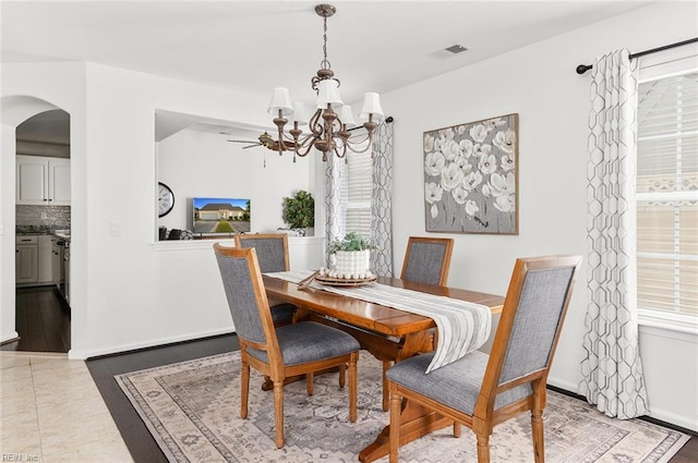 3009 Hogan Way, Suffolk, VA 23435 - dining space with a chandelier and arched walkways