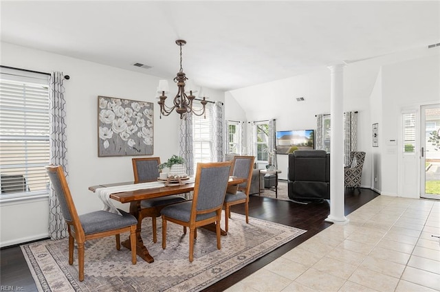 3009 Hogan Way, Suffolk, VA 23435 - dining space featuring a chandelier, decorative columns, light wood-style flooring, and baseboards
