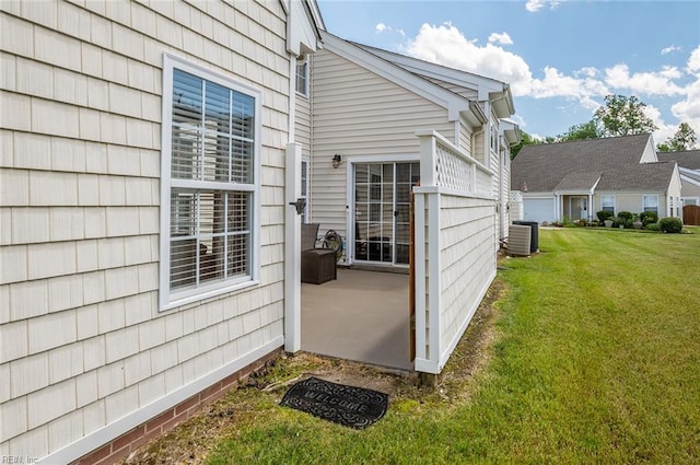 3009 Hogan Way, Suffolk, VA 23435 - doorway to property with cooling unit, a lawn, and a patio area