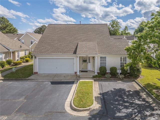 3009 Hogan Way, Suffolk, VA 23435 - view of front of home featuring asphalt driveway, a front lawn, a shingled roof, and an attached garage