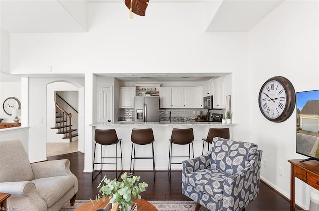 3009 Hogan Way, Suffolk, VA 23435 - living area featuring dark wood-type flooring, stairs, and baseboards