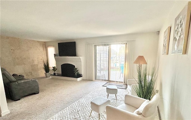 4402 Point W Dr, Portsmouth, VA 23703 - living room with carpet and a fireplace with raised hearth