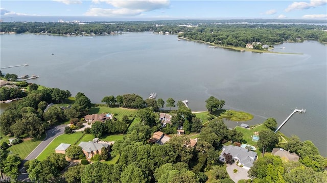 aerial view of property and surrounding area featuring a large body of water