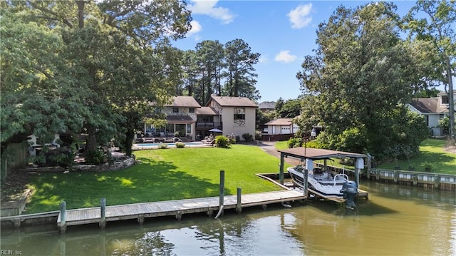 dock area with a water view, a lawn, a swimming pool, and boat lift