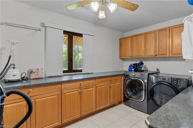 clothes washing area with cabinet space, separate washer and dryer, ceiling fan, and light tile patterned floors