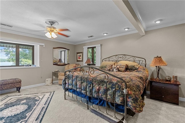 carpeted bedroom featuring multiple windows, crown molding, a textured ceiling, baseboards, and ceiling fan
