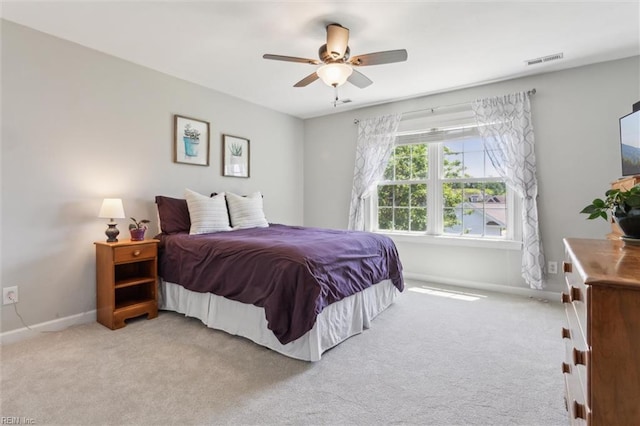 bedroom featuring carpet flooring, baseboards, and a ceiling fan