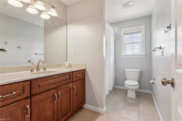full bathroom with toilet, vanity, tile patterned floors, and baseboards