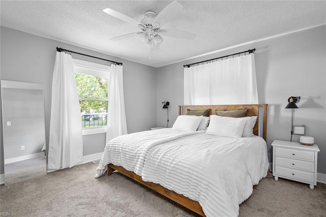 8209 Harlan Dr, Suffolk, VA 23436 - carpeted bedroom featuring baseboards, a textured ceiling, and a ceiling fan
