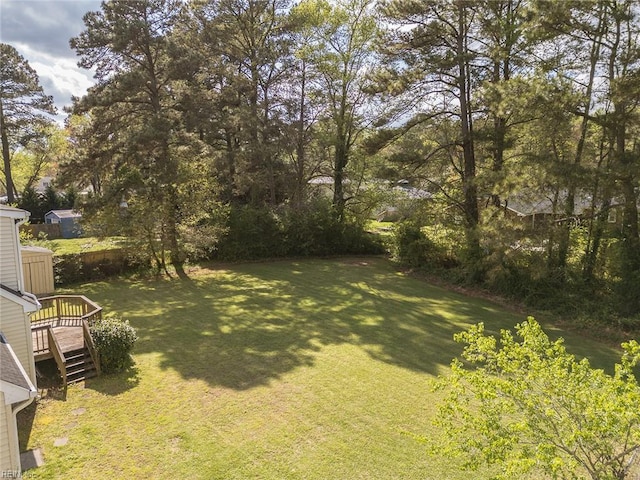 8209 Harlan Dr, Suffolk, VA 23436 - view of green lawn with a wooden deck