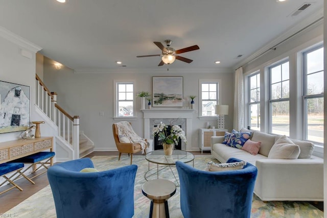 2234 Captiva Ln, Chesapeake, VA 23321 - living room with a premium fireplace, ornamental molding, stairs, a ceiling fan, and recessed lighting