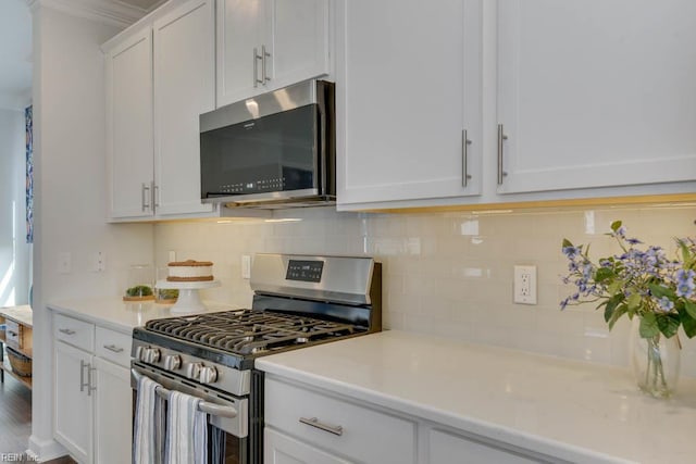 2234 Captiva Ln, Chesapeake, VA 23321 - kitchen featuring stainless steel appliances, light countertops, decorative backsplash, and white cabinetry