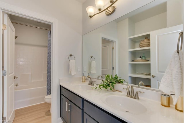 2234 Captiva Ln, Chesapeake, VA 23321 - bathroom featuring wood finished floors, toilet, double vanity, and shower / bath combo with shower curtain
