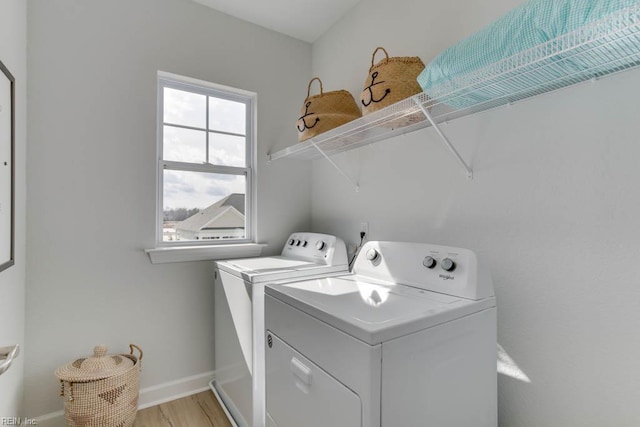 2234 Captiva Ln, Chesapeake, VA 23321 - laundry room featuring washing machine and dryer, baseboards, and light wood-style floors