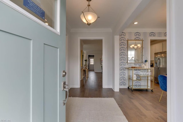 2234 Captiva Ln, Chesapeake, VA 23321 - foyer with crown molding, wood finished floors, baseboards, a chandelier, and wallpapered walls