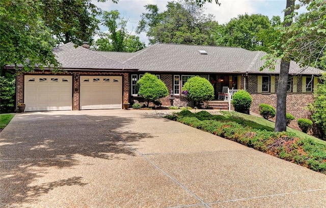 108 Devonshire Dr, Williamsburg, VA 23188 - ranch-style home with a garage, brick siding, a shingled roof, and driveway