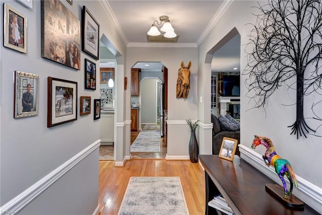 108 Devonshire Dr, Williamsburg, VA 23188 - hall with arched walkways, ornamental molding, light wood-style flooring, and baseboards