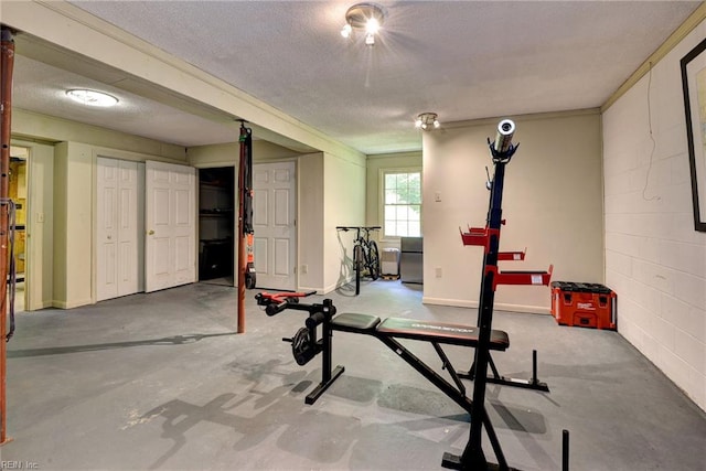 108 Devonshire Dr, Williamsburg, VA 23188 - exercise room featuring a textured ceiling and concrete block wall