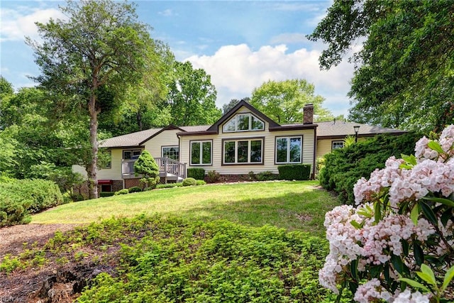 108 Devonshire Dr, Williamsburg, VA 23188 - back of house with a chimney, a wooden deck, and a yard