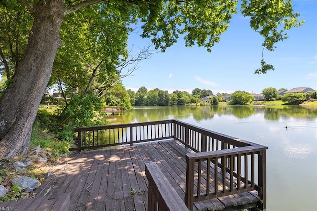 wooden deck featuring a water view