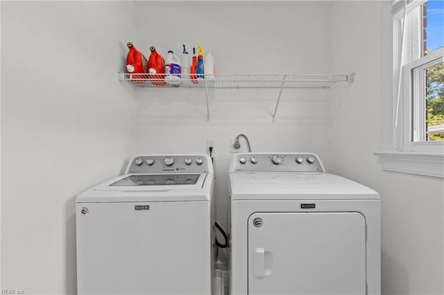 laundry room with washer and dryer