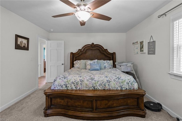 bedroom with baseboards, carpet flooring, and ceiling fan