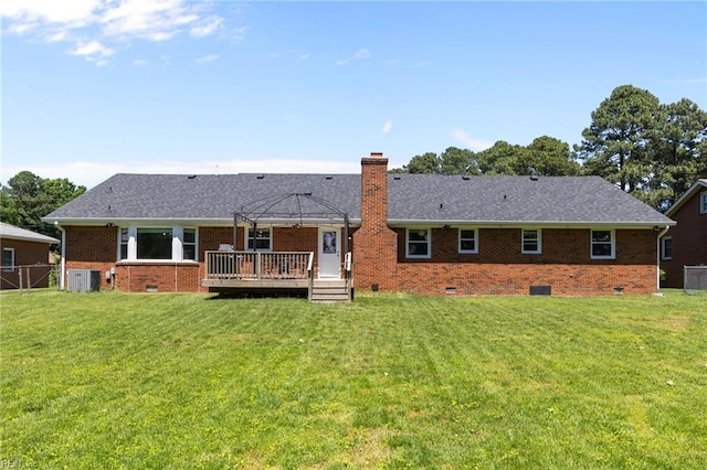 back of house with crawl space, central air condition unit, a deck, a chimney, and brick siding