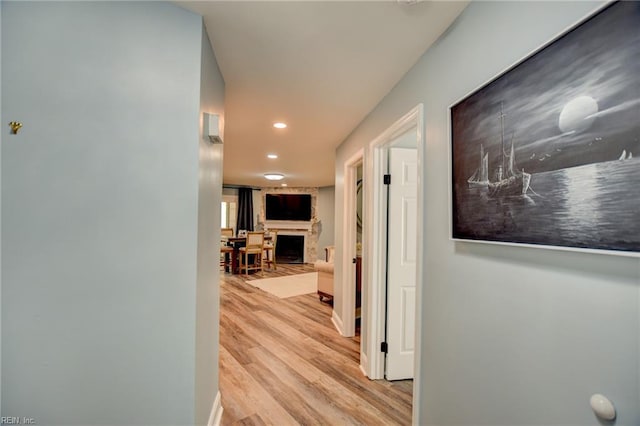 corridor featuring recessed lighting and wood finished floors