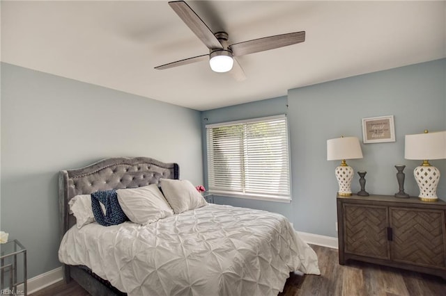 bedroom with wood finished floors, baseboards, and ceiling fan