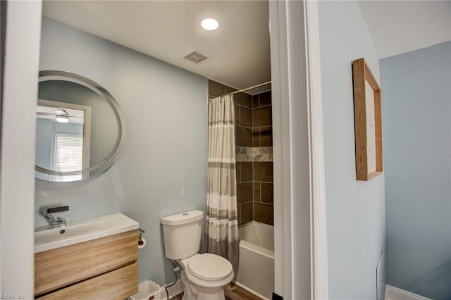 bathroom featuring vanity, toilet, and shower / bathtub combination with curtain
