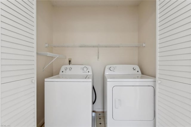 washroom with independent washer and dryer