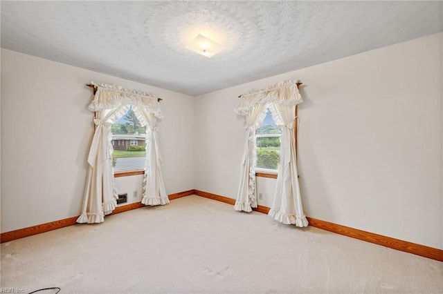2916 Taylor Rd, Chesapeake, VA 23321 - carpeted empty room featuring baseboards and a textured ceiling