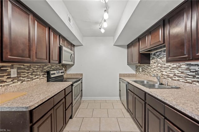 5607 Dodington Ct, Virginia Beach, VA 23462 - kitchen featuring stainless steel appliances, a sink, dark brown cabinetry, backsplash, and light tile patterned floors